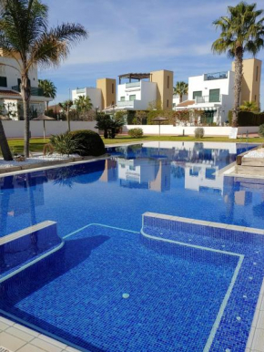 Three-bedroom holiday villa with magnificent pool next to the sea and golf courses